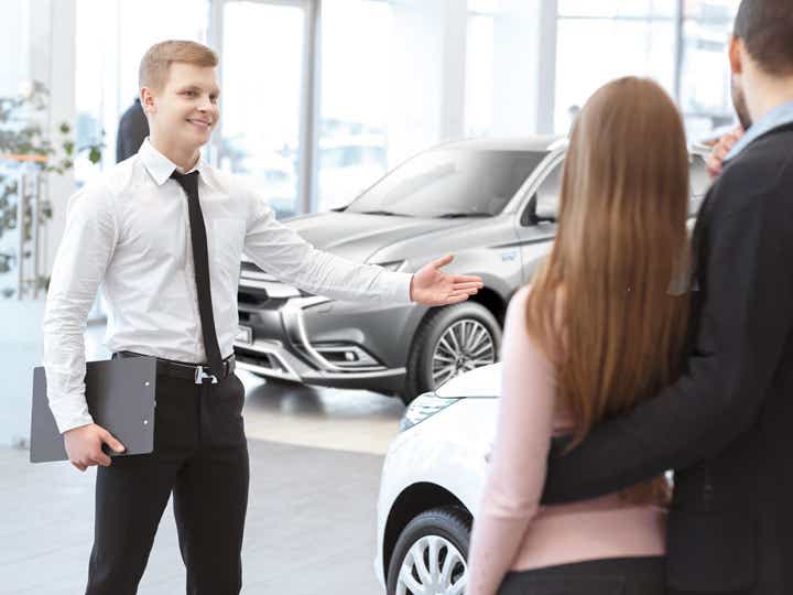 Salesman showing cars