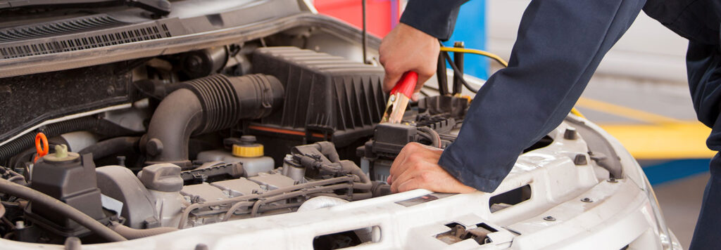 Mechanic checking battery