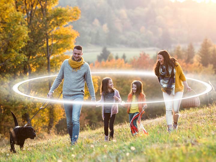 family walking a dog